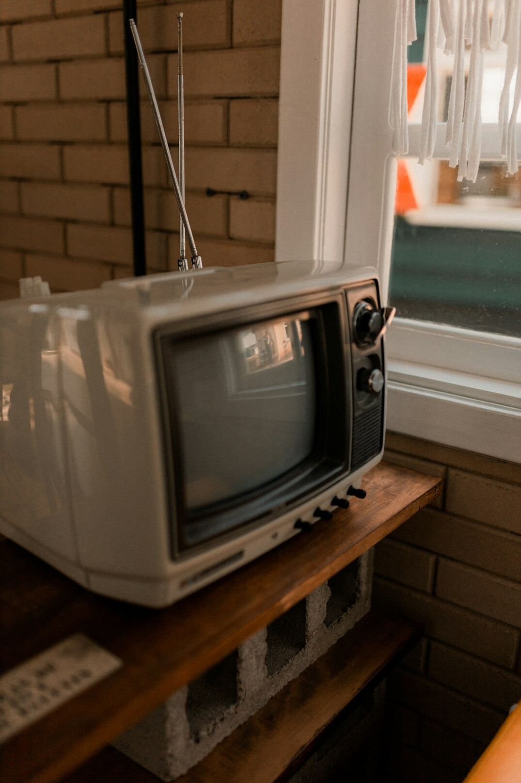 Turned-off gray CRT TV on a table